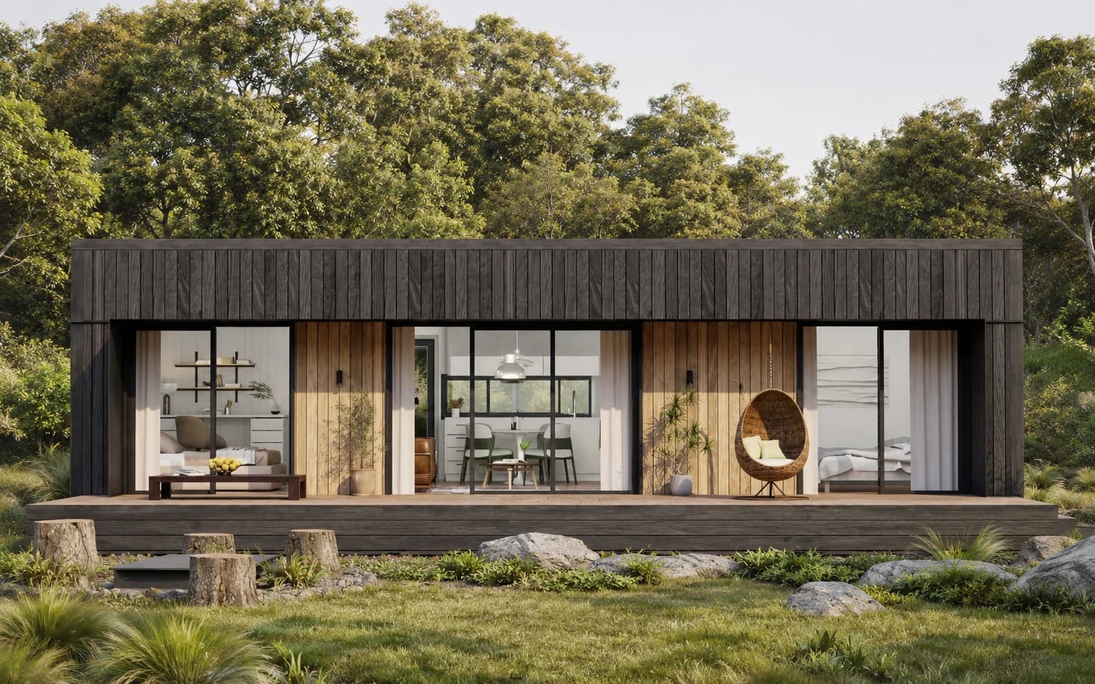 A timber-clad modular home with a wraparound deck under a clear sky